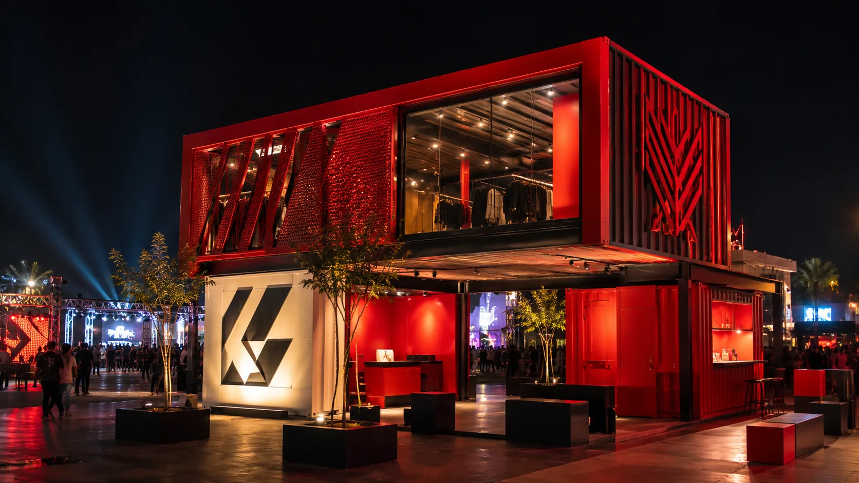 Stacked modular event pavilion illuminated at night
